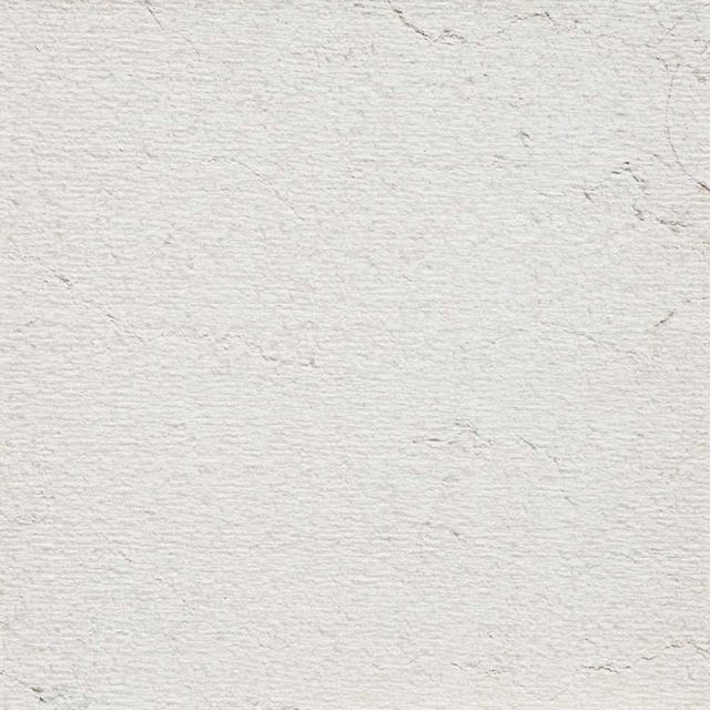 Finitura graffiata a mano, pietra bianca